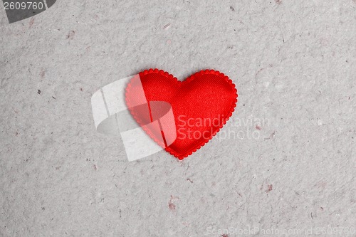 Image of red heart on vintage  paper background