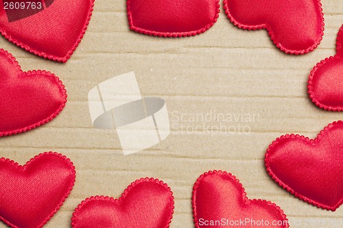 Image of red hearts on vintage  paper background