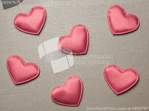 Image of red hearts on vintage  paper background
