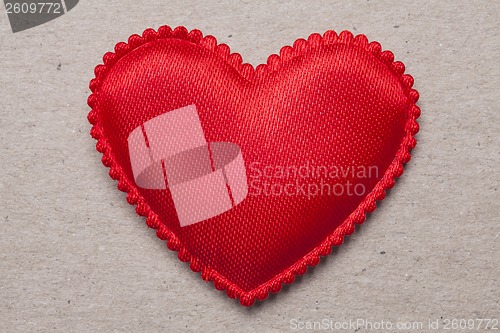 Image of red heart on vintage  paper background