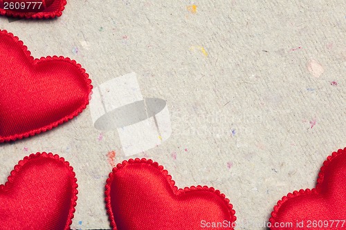 Image of red hearts on vintage  paper background