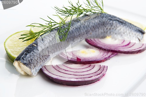 Image of Fillet herring with onion and lemon