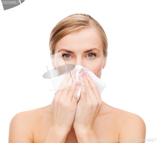 Image of beautiful woman with paper tissue