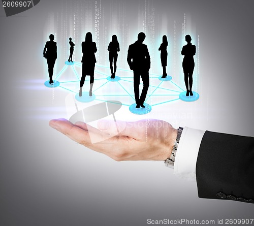 Image of mans hand showing social or business network