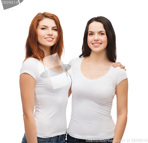 Image of two laughing girls in white t-shirts hugging