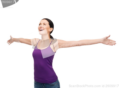 Image of smiling girl in blank purple tank top waving hands