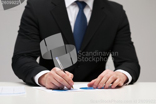 Image of close up of businessman with papers