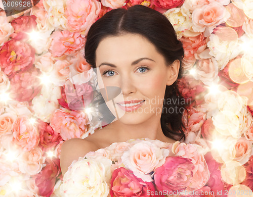 Image of woman with background full of roses