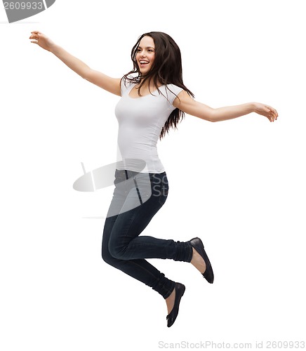 Image of teenage girl in white blank t-shirt jumping