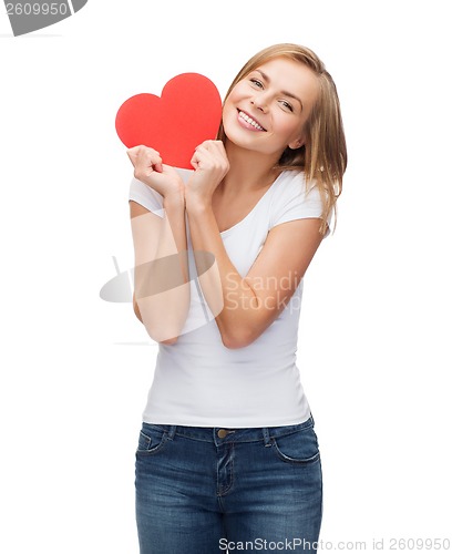 Image of smiling woman in white t-shirt with heart