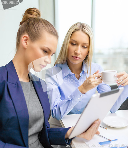 Image of business team with tablet pc having discussion