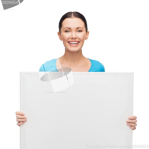 Image of smiling girl with white blank board