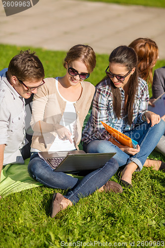 Image of students or teenagers with laptop computers