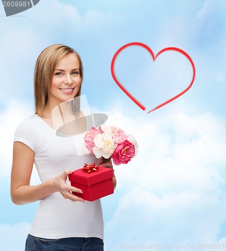 Image of smiling woman with bouquet of flowers and gift box