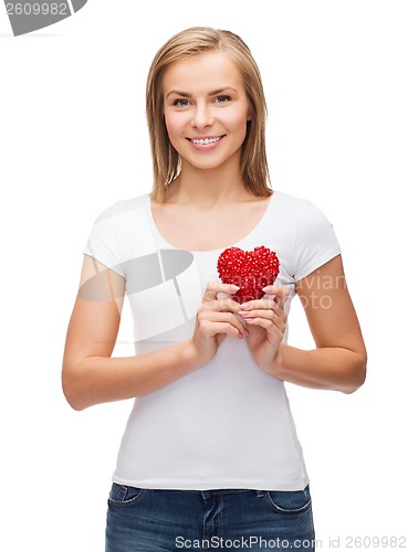 Image of smiling woman in white t-shirt with heart