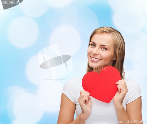 Image of smiling woman in white t-shirt with heart