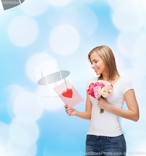 Image of smiling girl with postcard and bouquet of flowers