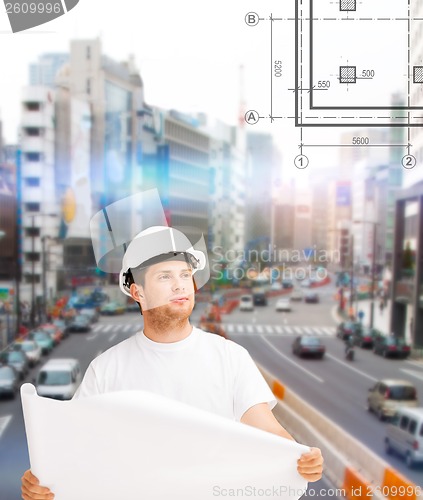 Image of male architect looking at blueprint