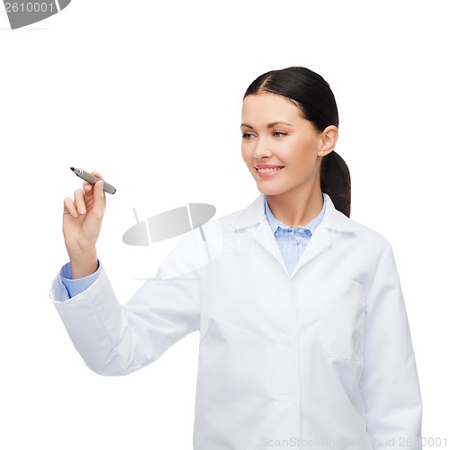 Image of female doctor working with something imaginary