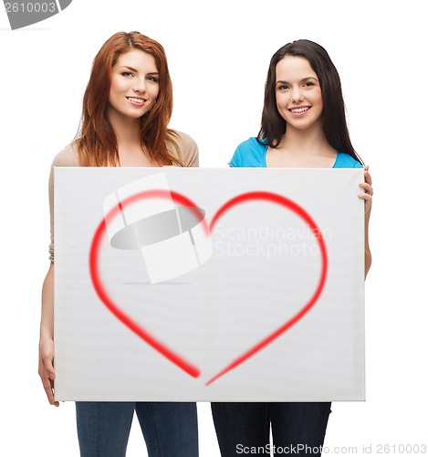 Image of two smiling young girls with blank white board