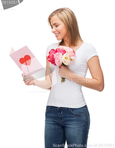 Image of smiling girl with postcard and bouquet of flowers