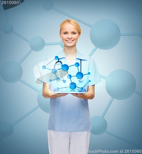 Image of smiling female doctor or nurse with tablet pc