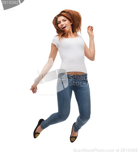 Image of teenage girl in white blank t-shirt jumping