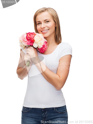 Image of smiling woman with bouquet of flowers