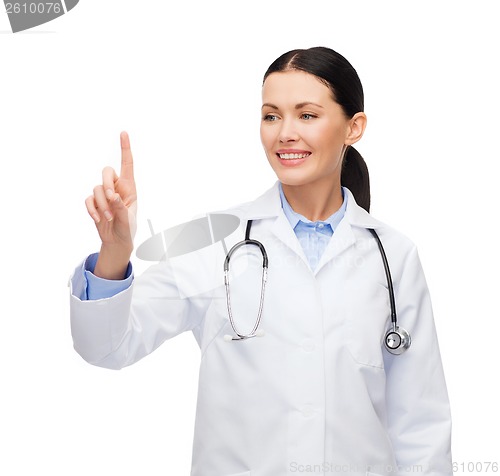 Image of smiling female doctor pointing to something