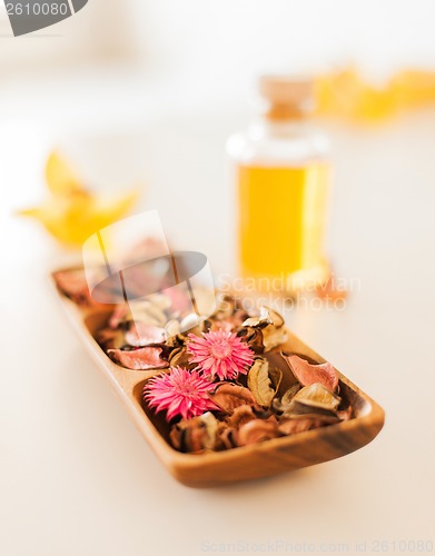 Image of closeup of essential oil, flowers and pot-pourri