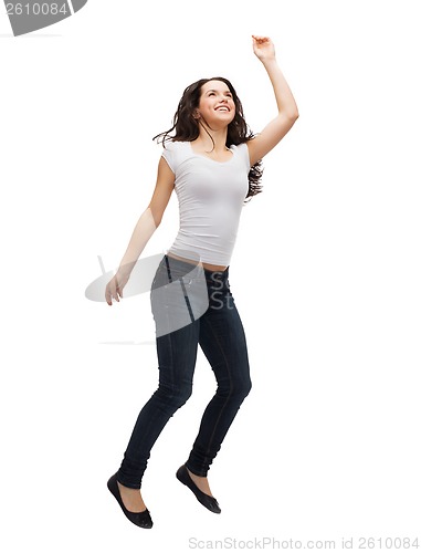 Image of teenage girl in white blank t-shirt jumping