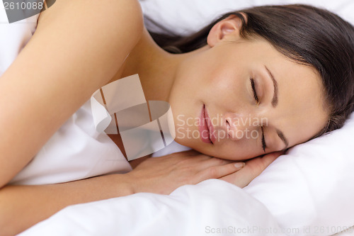 Image of beautiful woman sleeping in bed