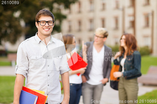 Image of teenage boy with classmates on the back