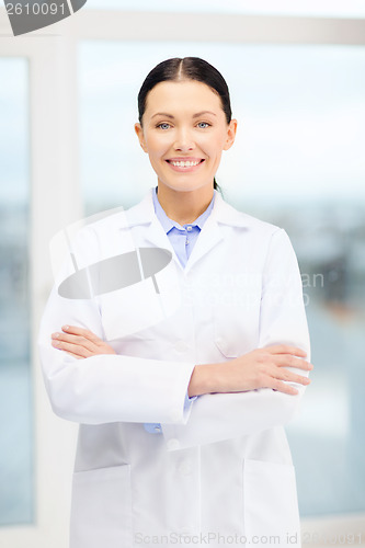 Image of smiling young doctor in cabinet