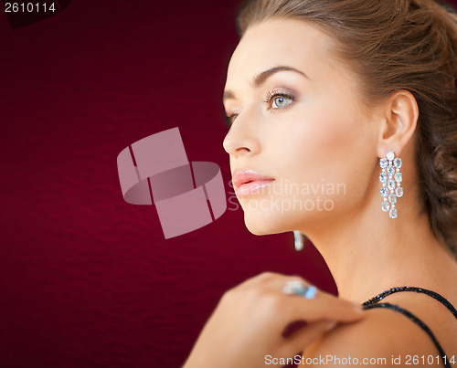 Image of woman with diamond earrings