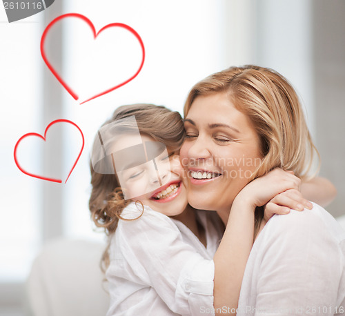 Image of smiling mother and daughter hugging