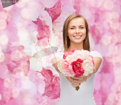 Image of smiling woman with bouquet of flowers