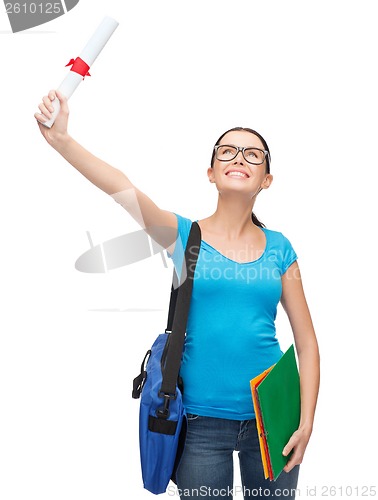 Image of smiling student with bag and folders