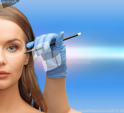 Image of woman face and beautician hands