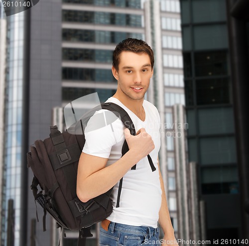 Image of travelling student with backpack outdoor