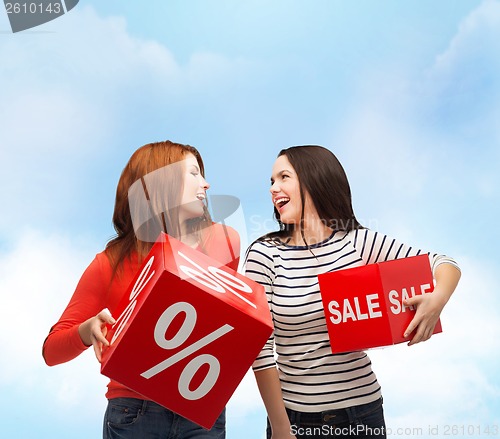 Image of smiling teenage girl with percent and sale sign