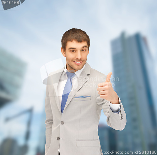 Image of handsome man with thumbs up