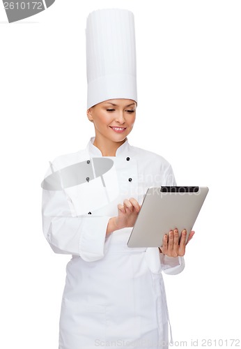 Image of smiling female chef with tablet pc computer