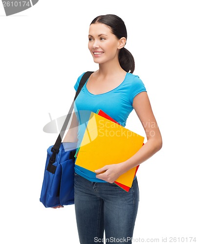 Image of smiling student with bag and folders