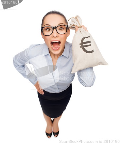 Image of amazed businesswoman holding money bag with euro