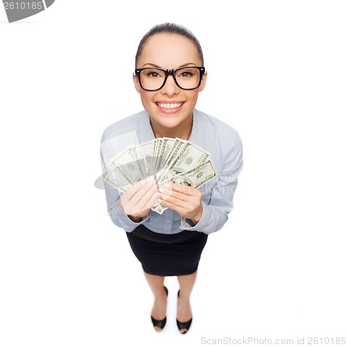 Image of smiling businesswoman with dollar cash money