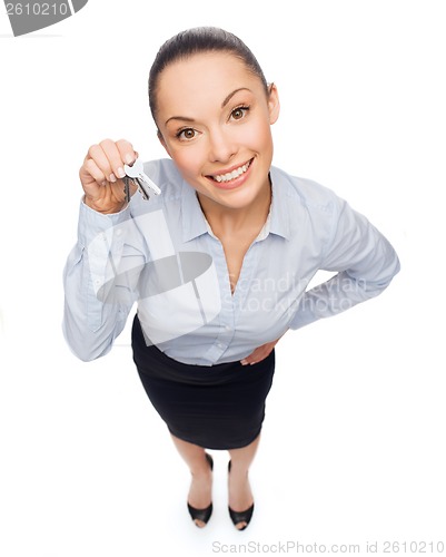 Image of smiling businesswoman with house keys