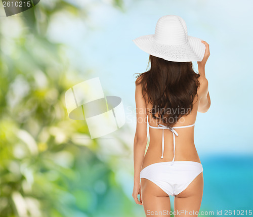 Image of beautiful woman posing in white bikini
