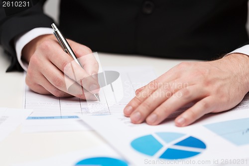 Image of close up of businessman with papers