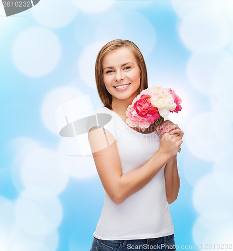 Image of smiling woman with bouquet of flowers